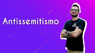 "Antissemitismo" escrito sobre fundo roxo ao lado da imagem do professor