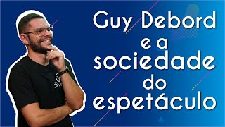 "Guy Debord e a sociedade do espetáculo" escrito sobre fundo azul ao lado da imagem do professor