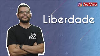 "Liberdade" escrito sobre fundo roxo ao lado da imagem do professor