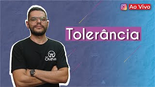 "Tolerância" escrito sobre fundo azul ao lado da imagem do professor