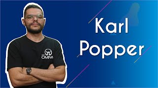 "Karl Popper" escrito sobre fundo azul ao lado da imagem do professor