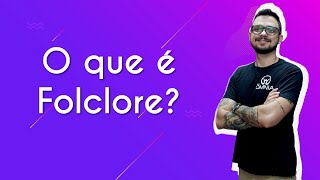 "O que é Folclore?" escrito sobre fundo roxo ao lado da imagem do professor