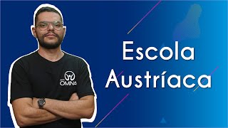 "Escola Austríaca" escrito sobre fundo azul ao lado da imagem do professor