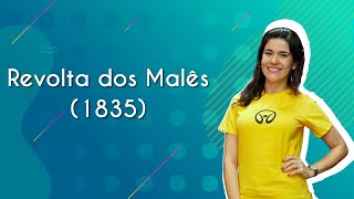 Professora ao lado do texto"Revolta dos Malês".
