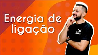 Professor ao lado do texto"Energia de ligação" em fundo laranja.