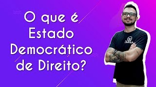 Professor ao lado do texto"O que é Estado Democrático de Direito?" em fundo roxo.