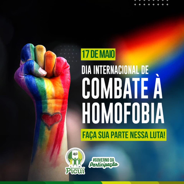 Propaganda sobre o combate à homofobia, com uma mão pintada com as cores do arco-íris e o punho levantado em protesto.