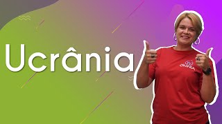 Professora ao lado do texto"Ucrânia".
