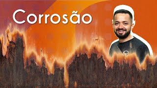 "Corrosão" escrito sobre fundo laranja e abaixo uma ilustração de um metal corroído