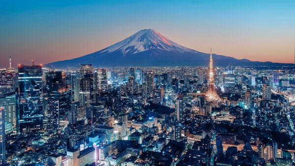 Vista panorâmica de Tóquio, exemplo de cidade global, com o monte Fuji ao fundo.