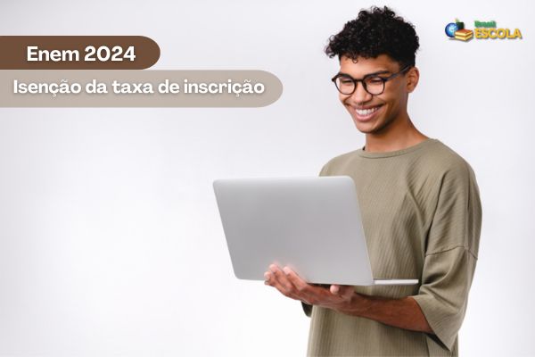 Estudante negro sorrindo com computador nas mãos, texto Enem 2024 Isenção da taxa de inscrição