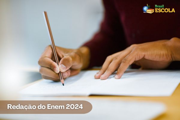 Pessoa escrevendo texto. Redação do Enem 2024