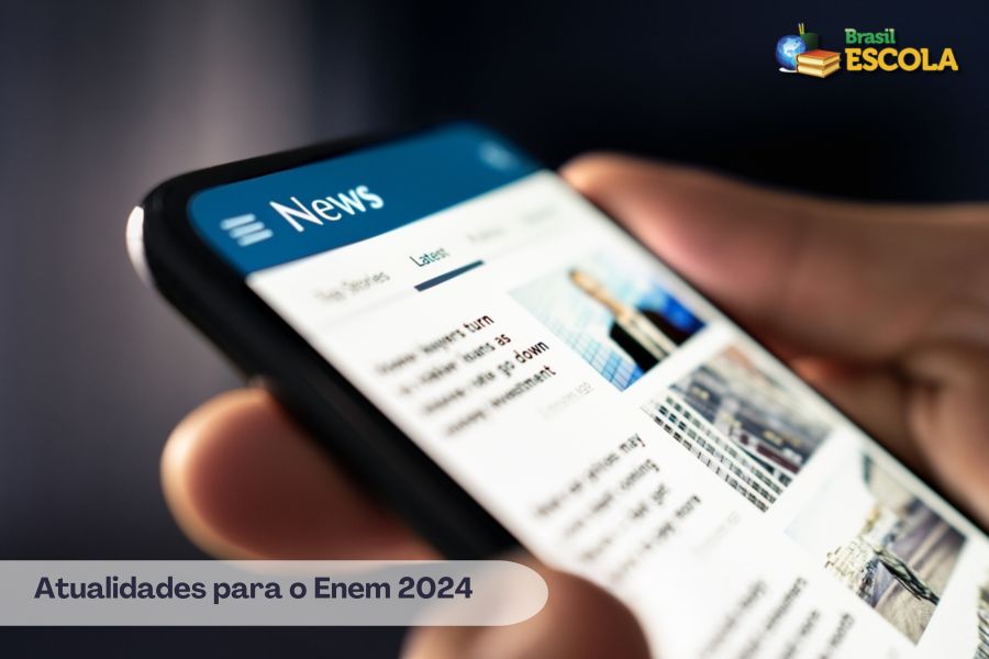 Celular mostra notícias. Texto Atualidades para o Enem 2024